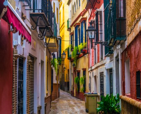 a narrow street situated in the center of the spanish city sevilla